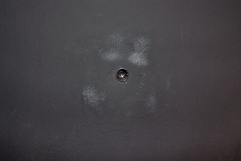 Lustmord — detail of peep-hole in door
