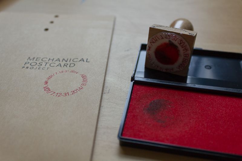 Mechanical Postcard — stamp and ink pad detail