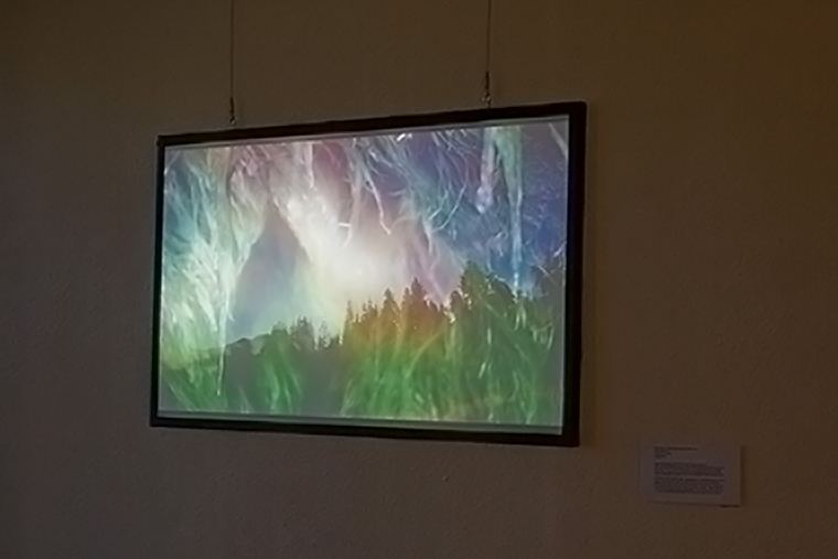 Apperception — wide gallery view with visitors and headphone pedestal